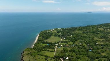 Coastline of Negros island and blue sea. Seascape: Ocean and blue sky. Philippines.