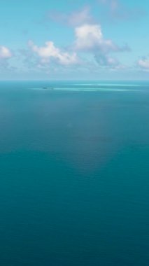 Surface of blue ocean and blue sky with cloud, aerial view. Water cloud horizon background.