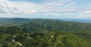 Aerial drone of mountains and hills with vegetation in the tropics. Negros, Philippines