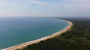 Aerial view of Tropical sandy beach and blue sea. Kalkudah Beach, Sri Lanka.