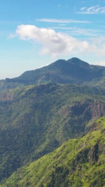 Aerial view of Mountains and green hills in Sri Lanka. Slopes of mountains with evergreen vegetation.