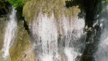 Beautiful waterfall in the rainforest in slow motion. Lusno Falls. Cebu, Philippines.