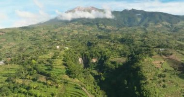 Farmland and rice terraces on the slopes of the Canlaon volcano view from above. Negros, Philippines