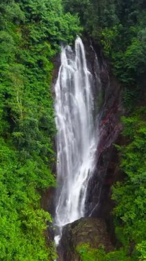 Waterfall in a tropical forest. Aerial drone of Mohini Falls. Sri Pada, Sri Lanka.