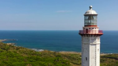 Lighthouse on hill. Cape Bojeador Lighthouse, Ilocos Norte, Philippines.