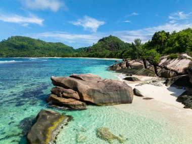 Sandy beach and beautiful rocks. Seychelles, Mahe. Baie Lazare Beach. clipart