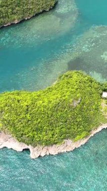 Aerial drone of islands in a beautiful bay in the tropics. Sipalay, Negros, Philippines.