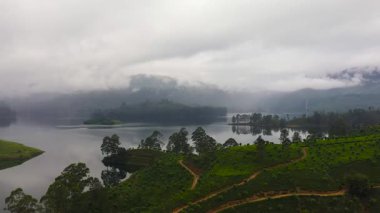 Aerial view of Lake in the mountains among the tea plantations. Maskeliya, Maussakelle reservior, Sri Lanka.