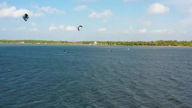 Aerial drone of Kitesurfers enjoying wind power on Kalpitiya beach. Kitesurfing in the tropics. Sri Lanka.