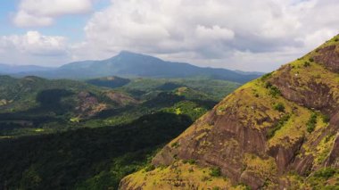 Mountain slopes covered with rainforest and jungle. Sri Lanka. View of the valley in the mountain province.