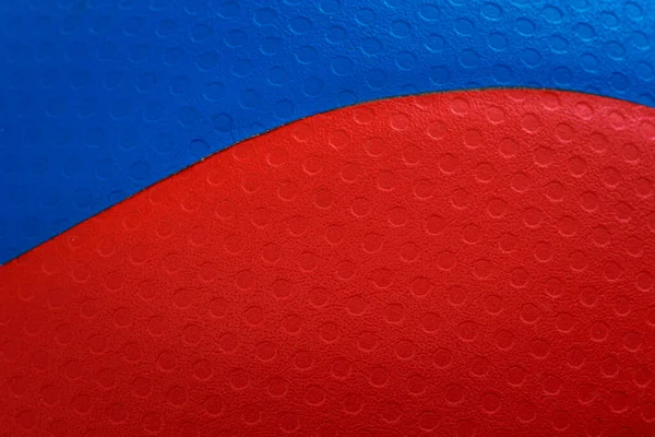 排球的红色和蓝色质感 图库照片
