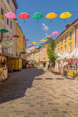 Villach, austria - August 5, 2022: Colorful umbrellas in a street the Austrian village of Villach on a summer day