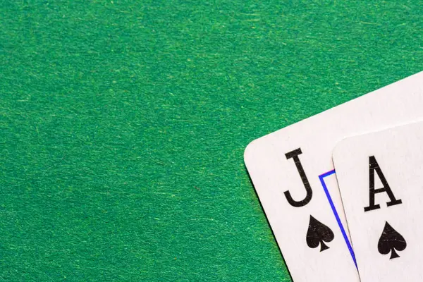Jack of Spades and Ace of Spades or Blackjack on a green background