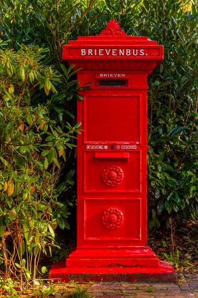 A  Dutch Retro style red mail box