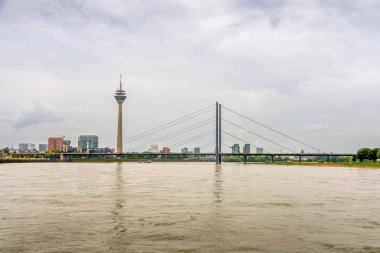 Dusseldorf Skyline with Rheinturm and Bridge Over the Rhine River clipart