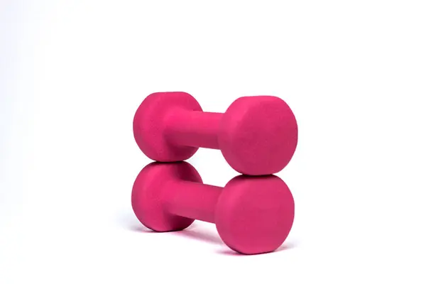 Beyaz arkaplanda izole edilmiş pembe halterler.