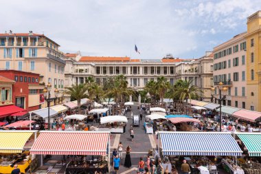 Nice, Alpes-Maritimes, Provence-Alpes-Cote-dAzur, France  23 May 2022: Cours Saleya Flower Market and the prefecture of the alpes-martimes in the old Nice