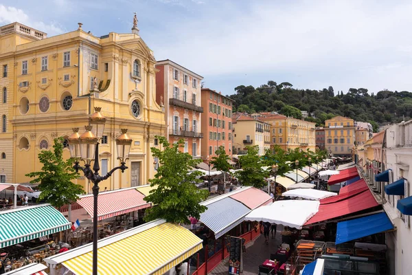 Nice, Alpes-Maritimes, Provence-Alpes-Cote-dAzur, France  23 May 2022: Cours Saleya Flower Market with the Chapel of Mercy in the old Nice