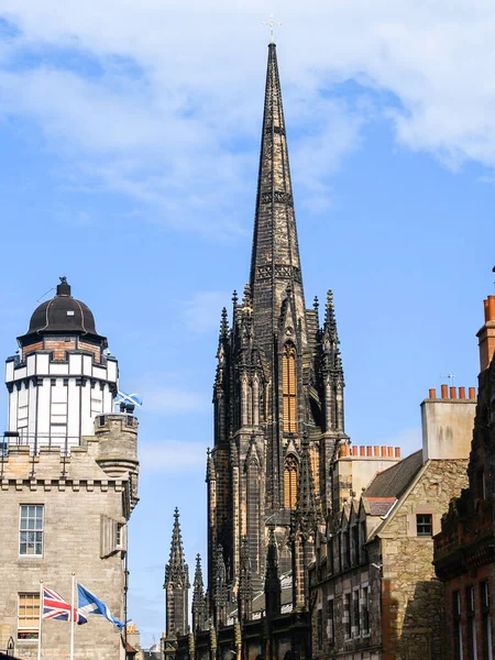 Gothic architecture of Tolbooth Church beside Camera Obscura dome in Edinburgh Scotland