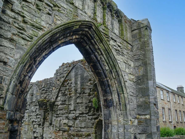 Medieval remains stone arch shape open to sky.