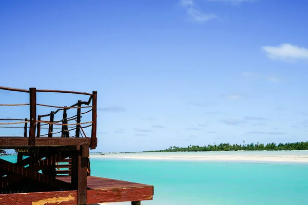 Tropical island paradise wooden deck in idyllic landscape on Aitutaki Island.