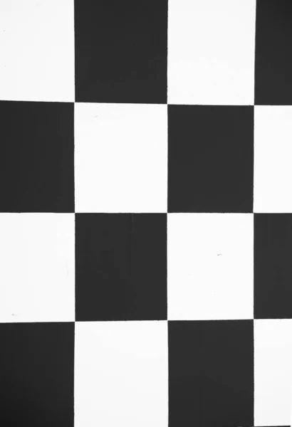 Black and white squares in checker pattern in vertical composition