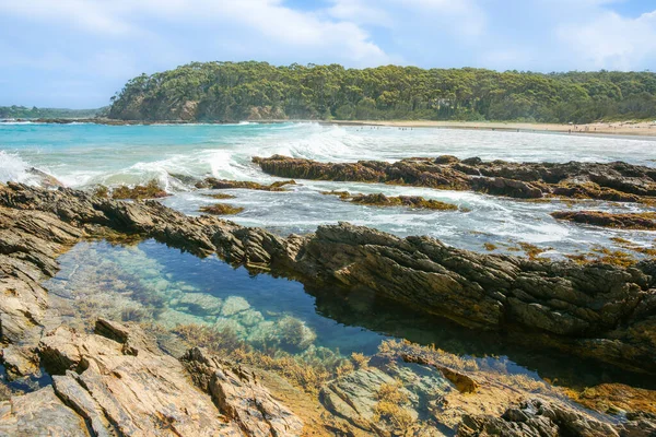 Rock pools in rocky foreshore in scenic Batemans Bay New South Wales