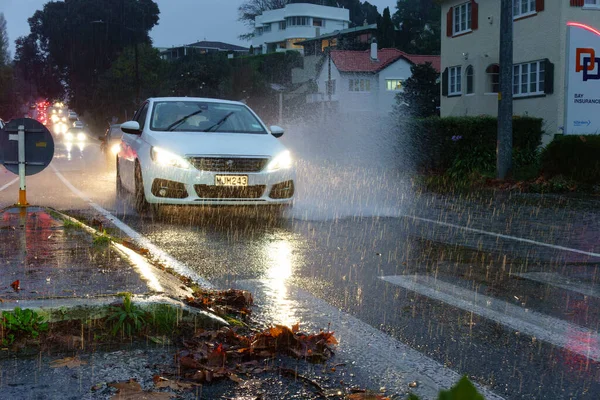 stock image Tauranga New Zealand - May 9 2023; rush hour traffic splashing a spray of water during torrential downpour