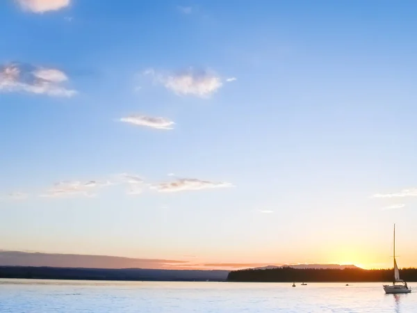 stock image Sun setting over distant hills and Tauranga harbour