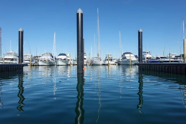 Marina Pilings Reflected Blue Water Moored Luxury Boats Blue Sky — Stock Photo, Image