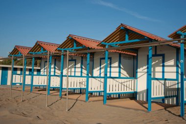Row of changing sheds in beach on Lido Venice in Italy.