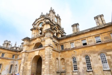 Woodstock United Kingdom - July 25 2024; English baroque style of facade, clock tower and entrance to Blenheim Palace. clipart