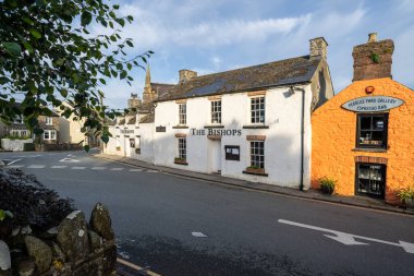 St.David's Wales - August 3 2024; Welsh city buildings and street scene at sunrise clipart