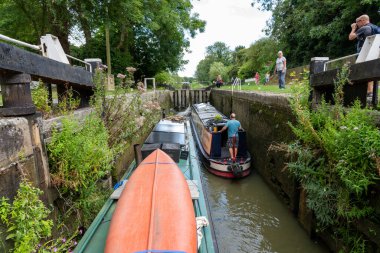 Devizes United Kingdom - August 10 2024; Locks and boats passing through Kennet and Avon Canal clipart