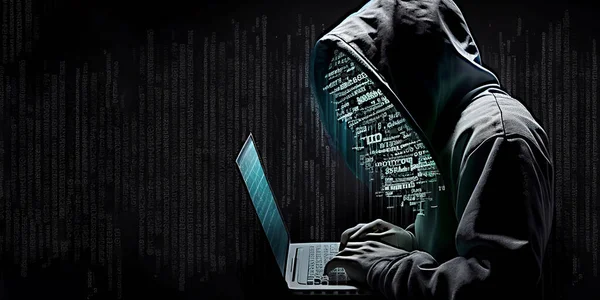 Hacker in hoodie with laptop computer, dark security technology background concept