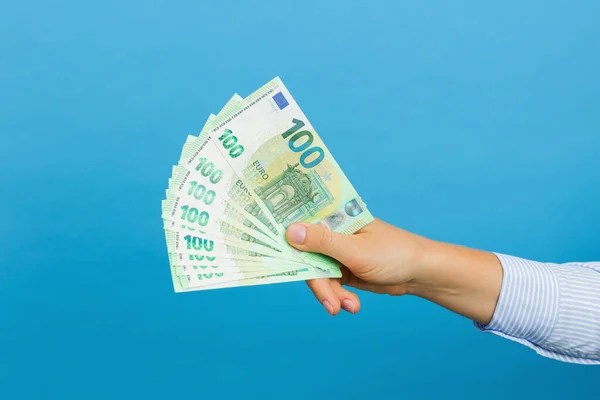Woman Hand Holding Hundred Euros Banknotes Isolated Blue Background Euro — Foto de Stock