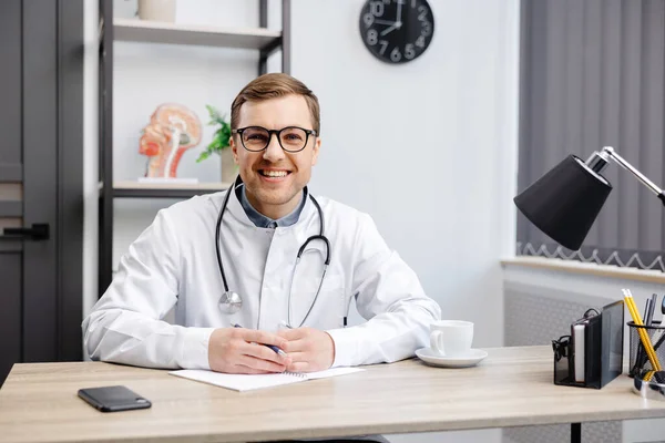 Portrait Young Doctor Wearing Glasses White Uniform Stethoscope Speaking Consulting — Foto Stock