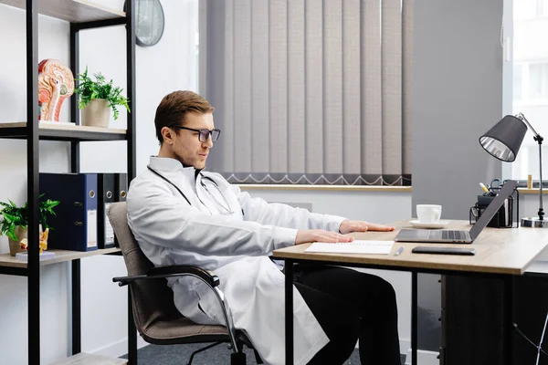 Young Male Doctor Sits His Workplace Feels Tired Work Doctor — Foto Stock
