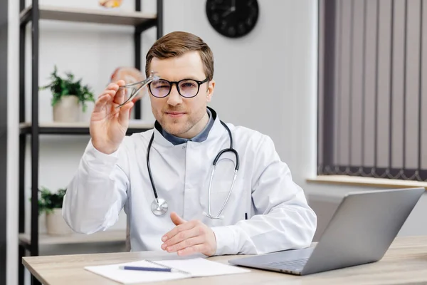 Young Attractive Otolaryngologist Doctor Sitting His Workplace Office Holding Nose — Foto Stock