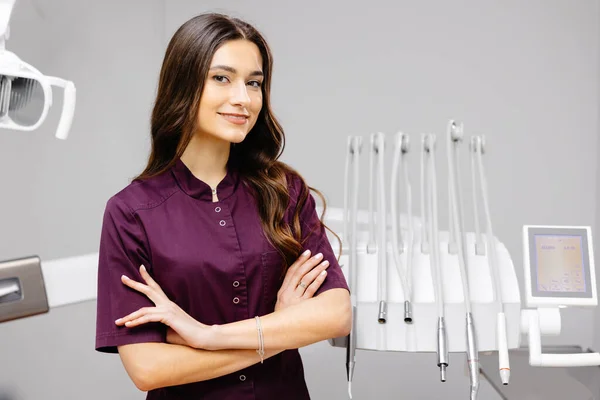 Young Pretty Female Dentist Standing Dental Chair Office Her Arms — Stock Photo, Image