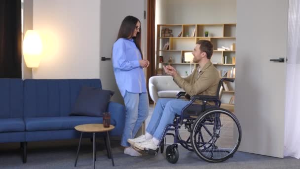 Man Wheelchair Extend Her Hand Palm Side Woman Giving Key — Stock Video