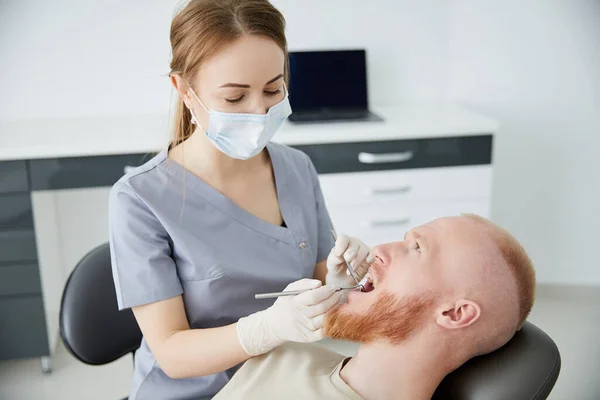 Portrait Young Female Dentist Standing Mid Adult Man Clinic — Stock Photo, Image
