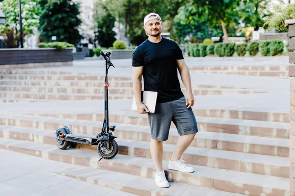Handsome Man Holding Laptop His Hand Standing Electric Scooter Active — Photo