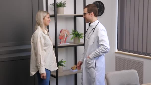 Young Attractive Doctor Having Consultation His Office Doctor Making Notes — Wideo stockowe