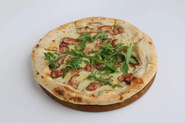 Bacon Pizza. Italian Pancetta Tartufo Pizza with bacon and mozzarella cheese on wooden board on white background.
