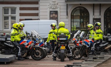 Amsterdam, The Netherlands, 24.02.2023, Dutch policemen on motorcycles in the street