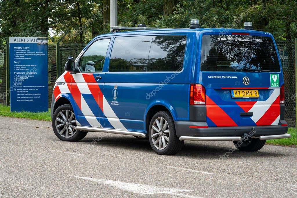 Volkel, The Netherlands, 07.08.2023, Patrol car of The Royal Netherlands Marechaussee in front of dutch military air base Volkel