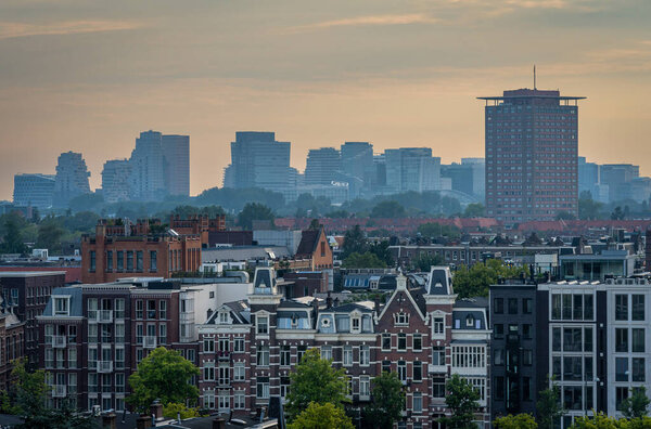 Skyline of Amsterdam seen from the rooftop with a view on modern high-rise buildings in the Zuidas district