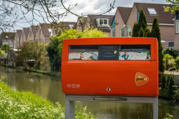 Zwolle Netherlands 2024 Typical Orange Mailbox Dutch Postnl Letterbox Жилом — стоковое фото