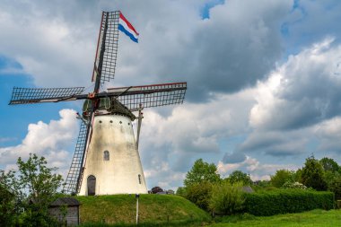 Historical white windmill De Volharding from 1891 in the village of Zeddam, Province Gelderland, The Netherlands clipart